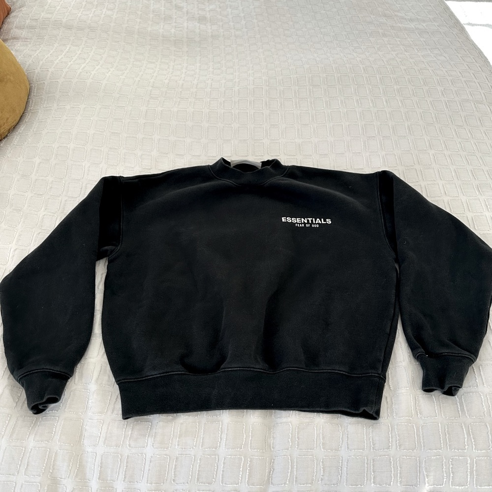 Fear of God Essentials, black crewneck sweatshirt.